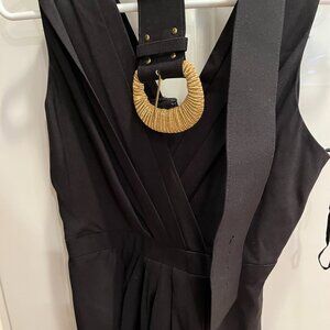 Sleeveless little black dress with gold buckled belt